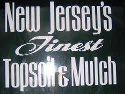 New Jersey's Finest Topsoil & Mulch on the side of a big dumptruck