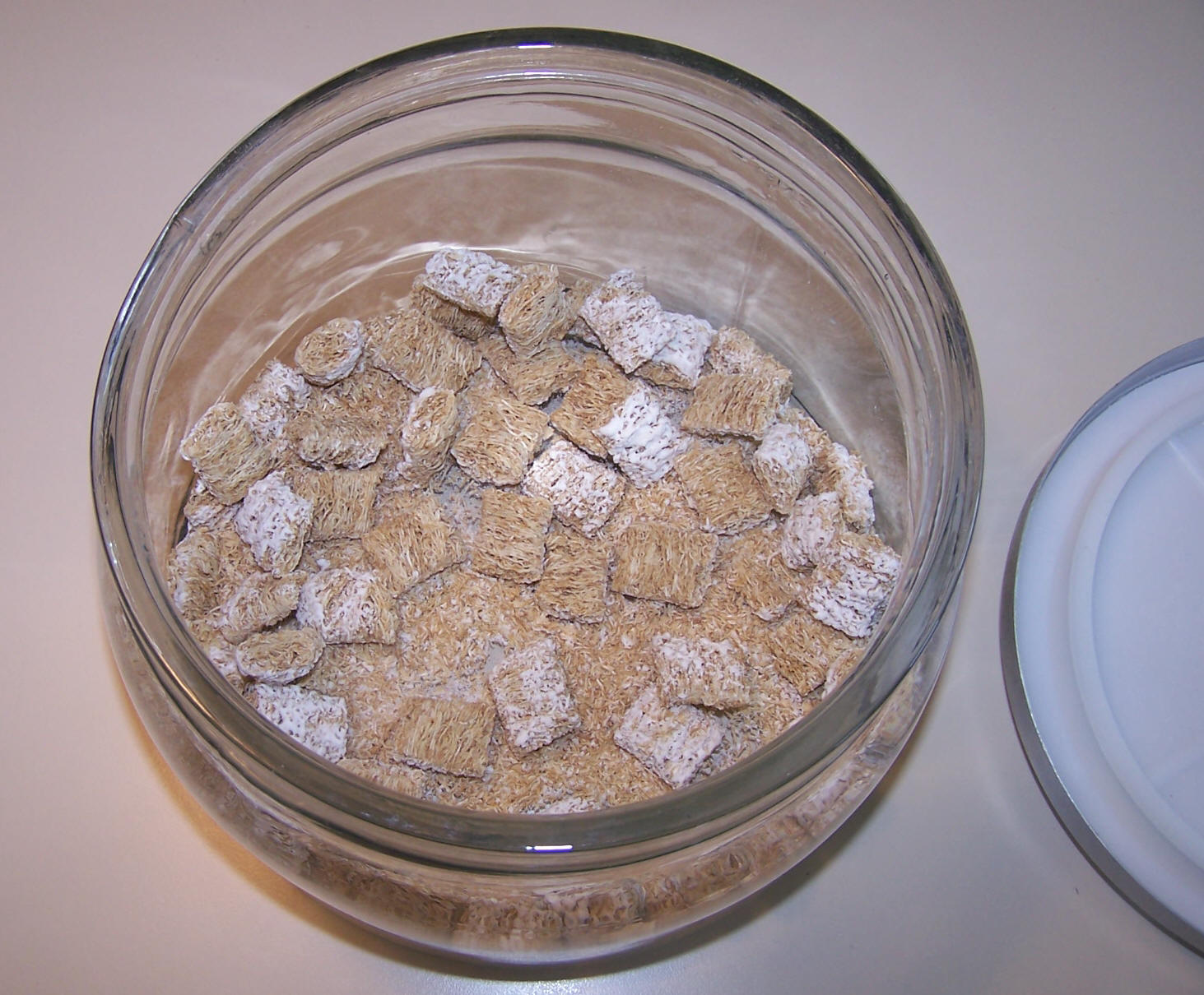 Bowl of bite-size Shredded Wheats almost depleted