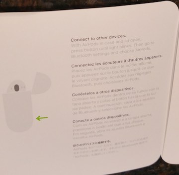 Apple Air Pod manual page with unreadably light text