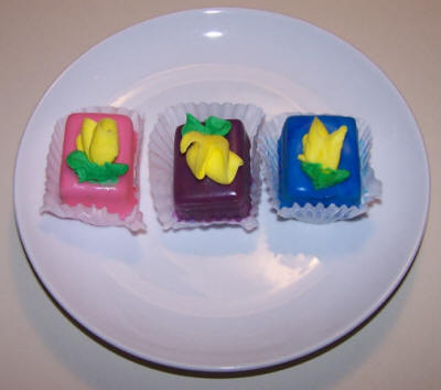 Pink, purple and blue petit fours from the Viking Bakery